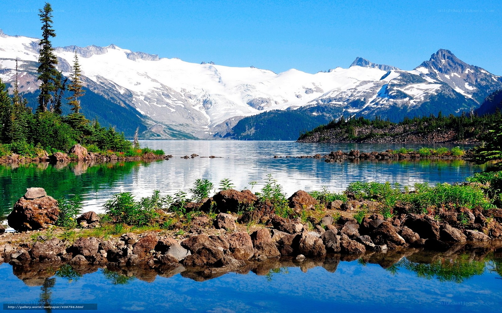 Snow-capped mountains and lake