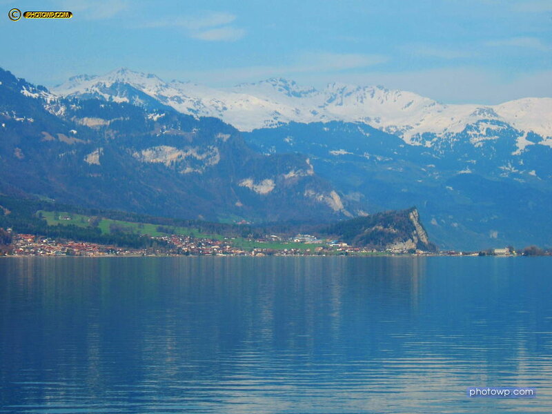 Snow-capped Mountains and Lake — Blue, Serene, Afternoon, Photograph, Village