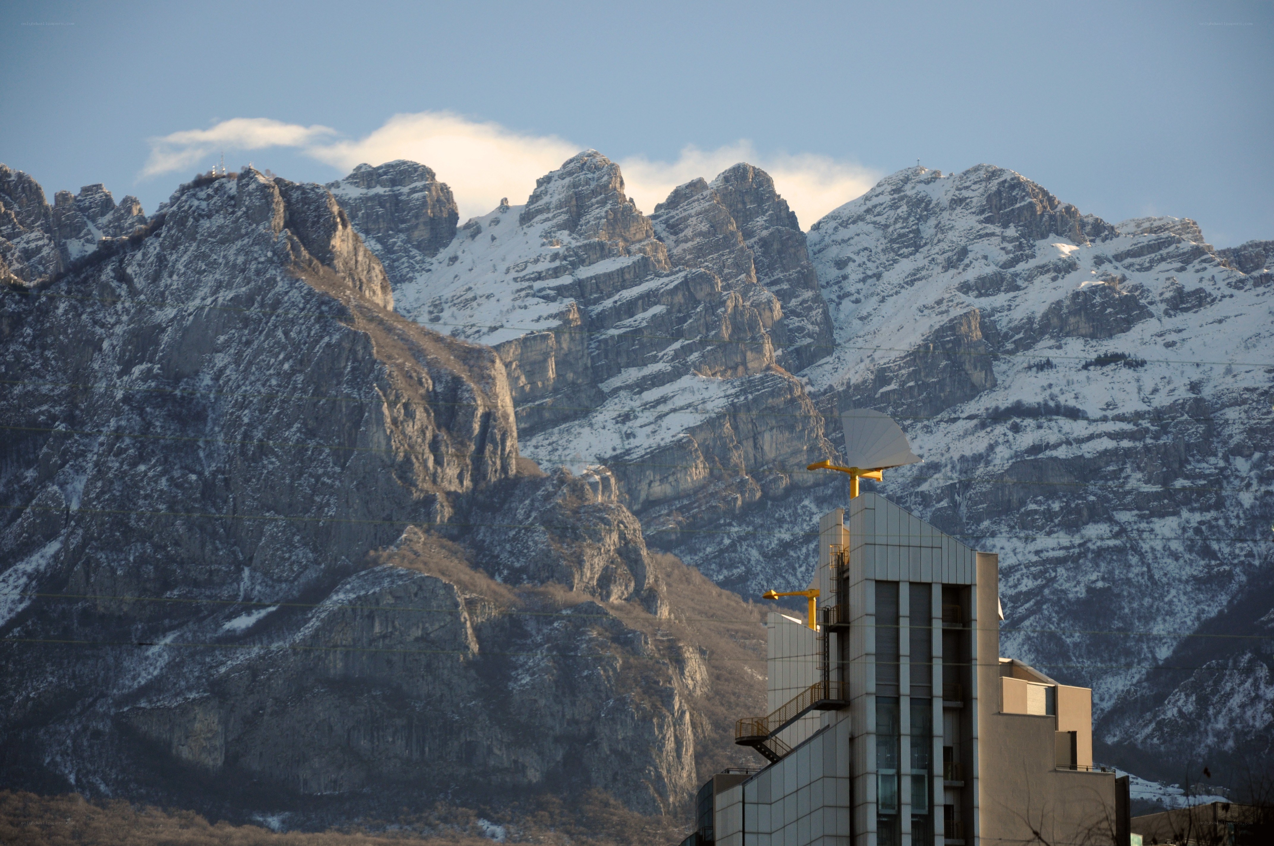 Snow-capped mountains and modern building