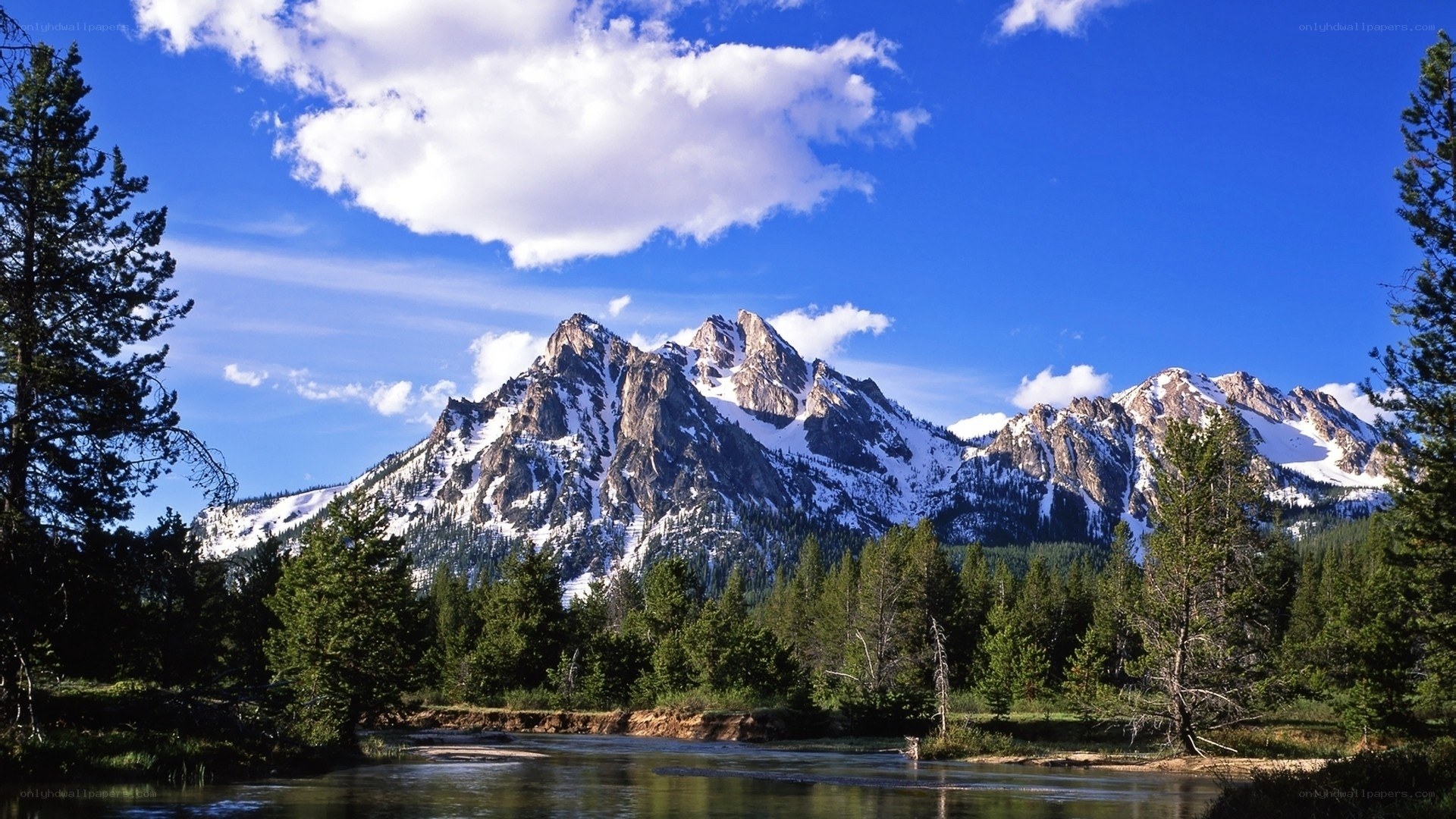 Snow-capped mountains and river