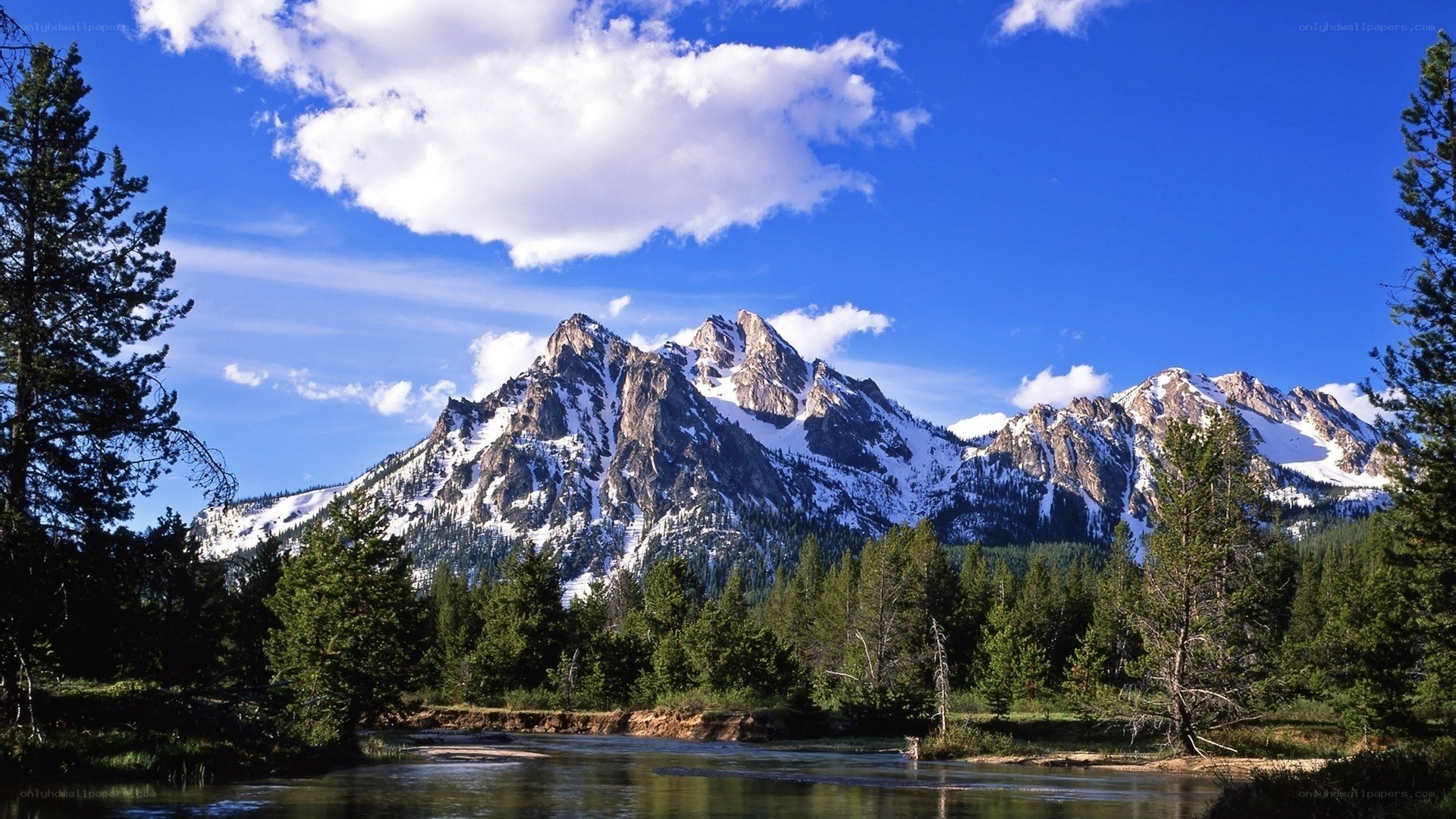 Snow-capped mountains and river