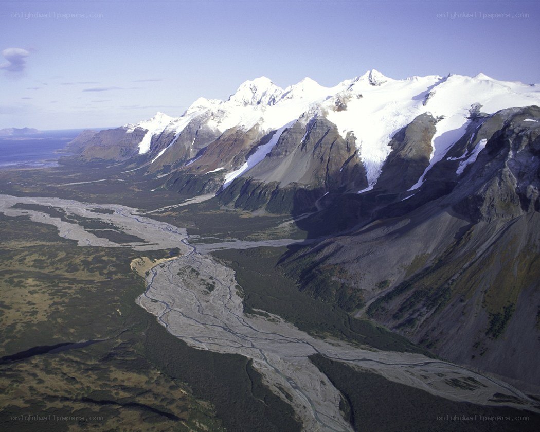 snow-capped mountains and river valley