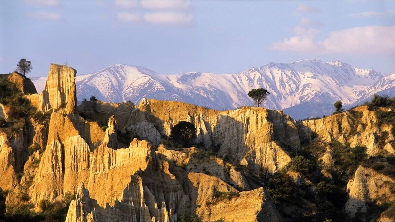 Snow-capped mountains and rock formations