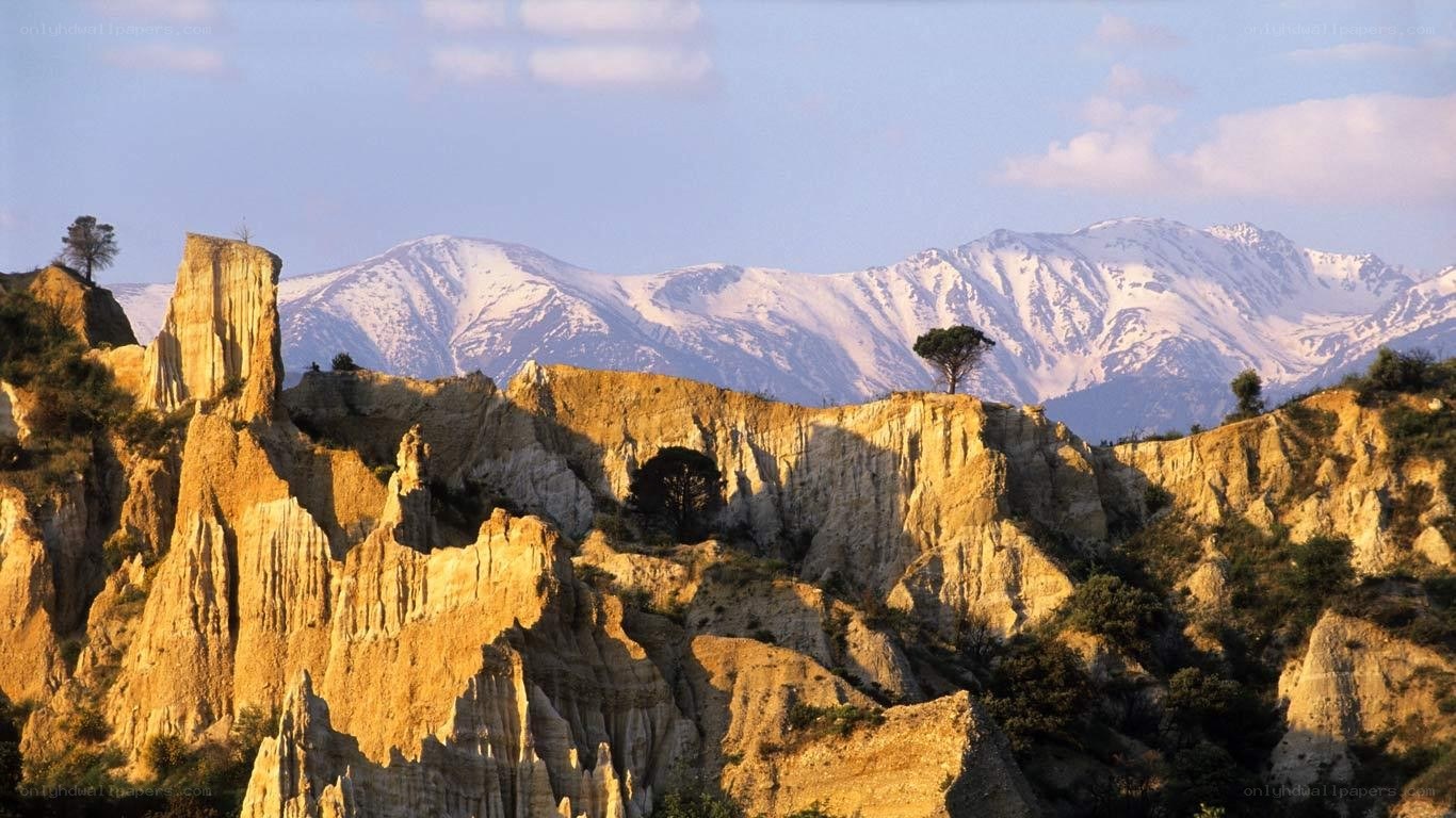 Snow-capped mountains and rock formations