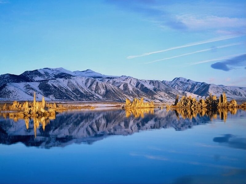 Snow-capped mountains and tufa formations