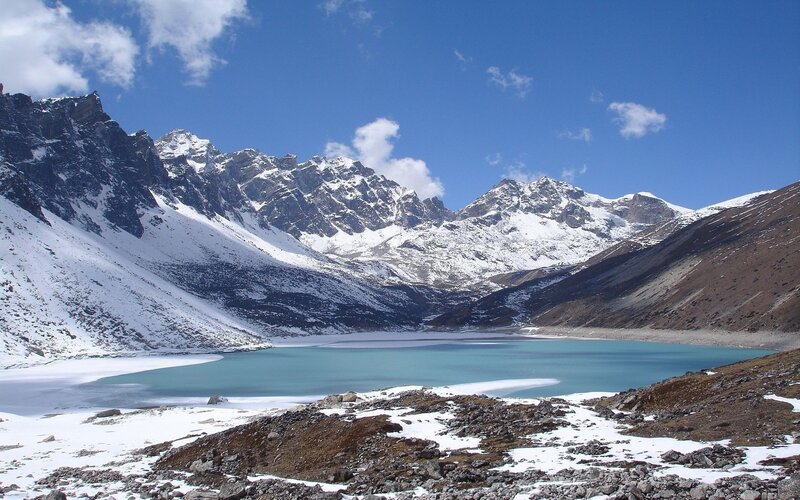 snow-capped mountains and turquoise lake