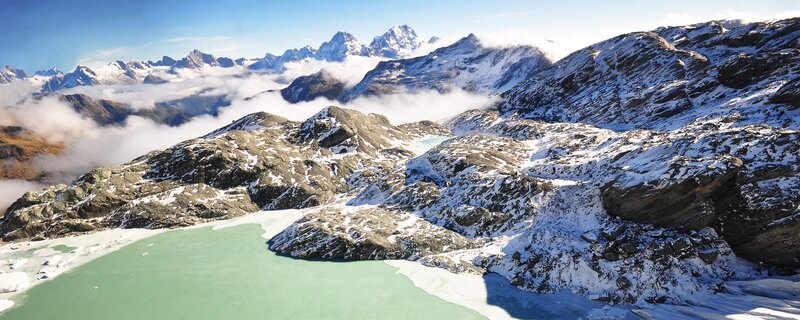 snow-capped mountains and turquoise lake