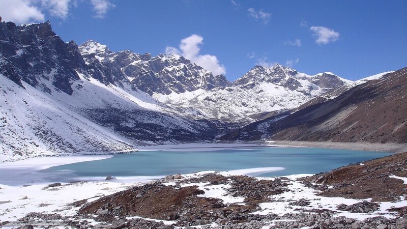 snow-capped mountains and turquoise lake