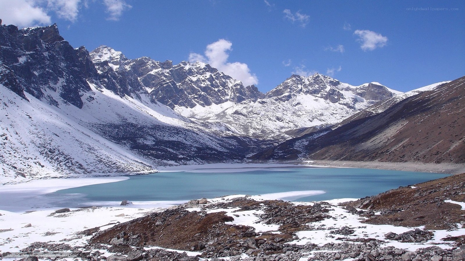 snow-capped mountains and turquoise lake