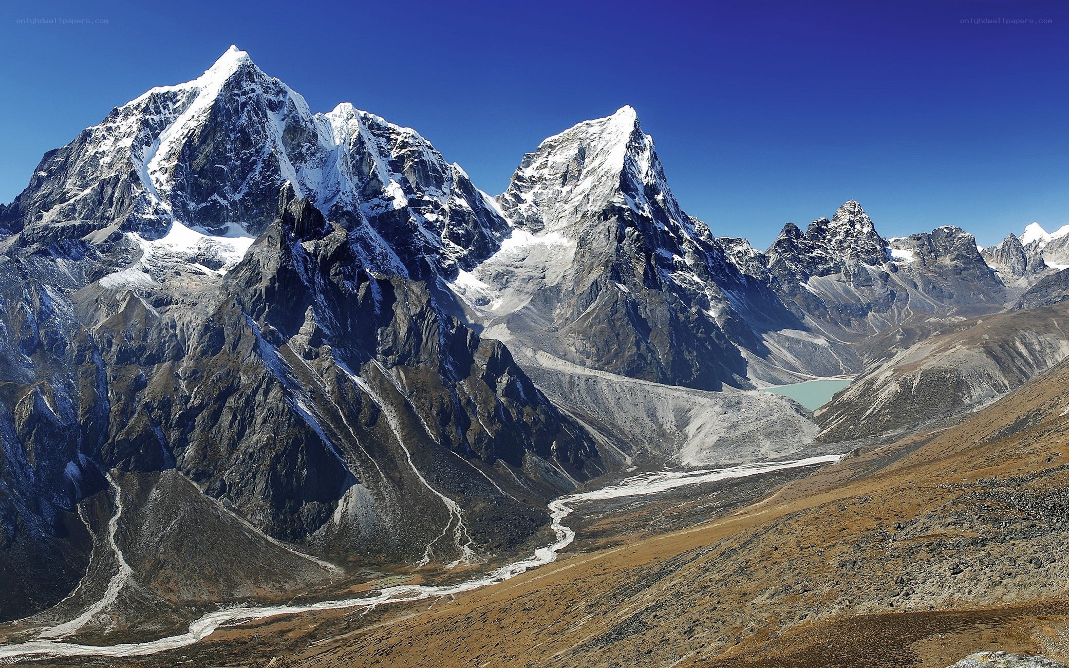 Snow-capped mountains and valley
