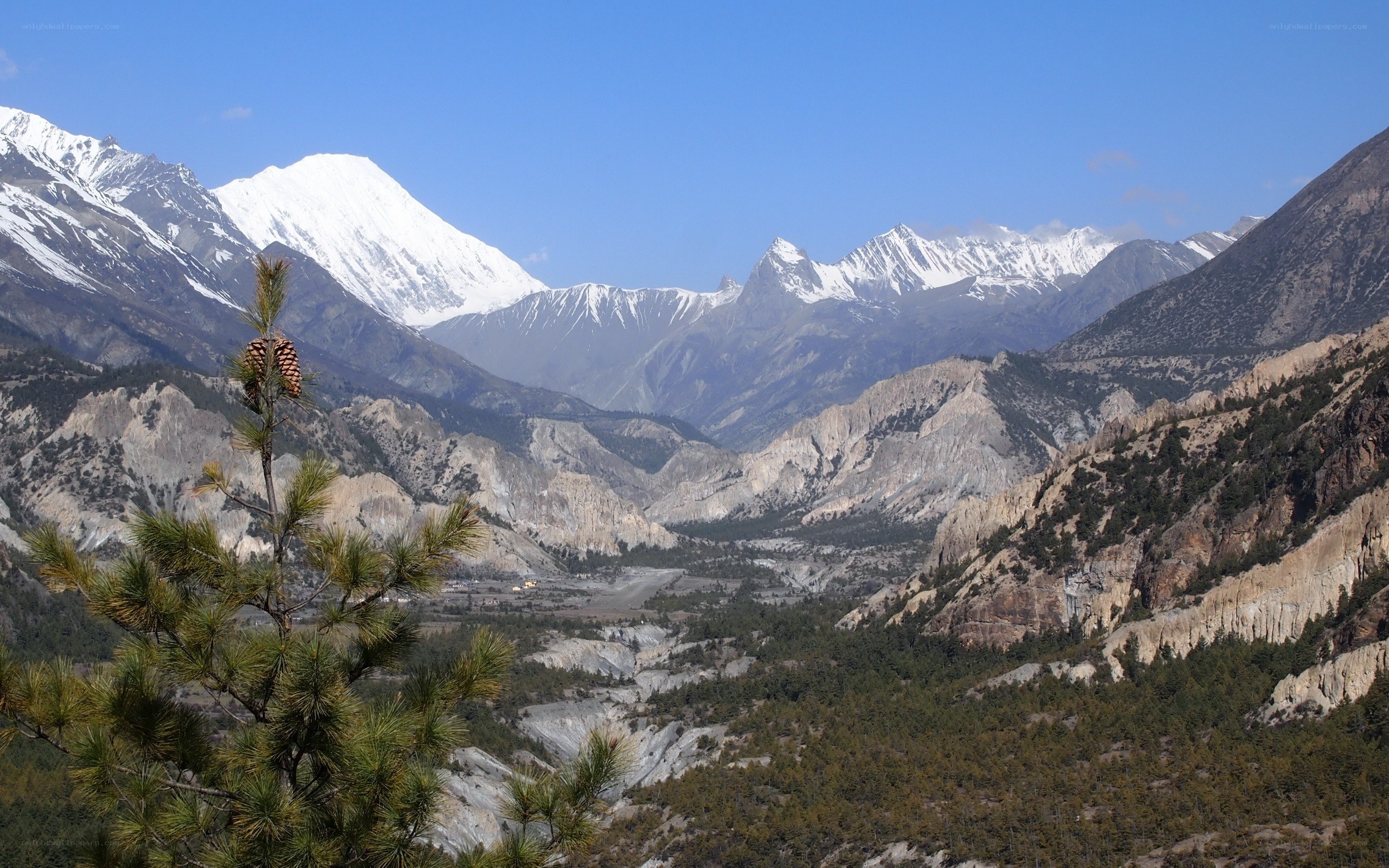 Snow-capped mountains and valley