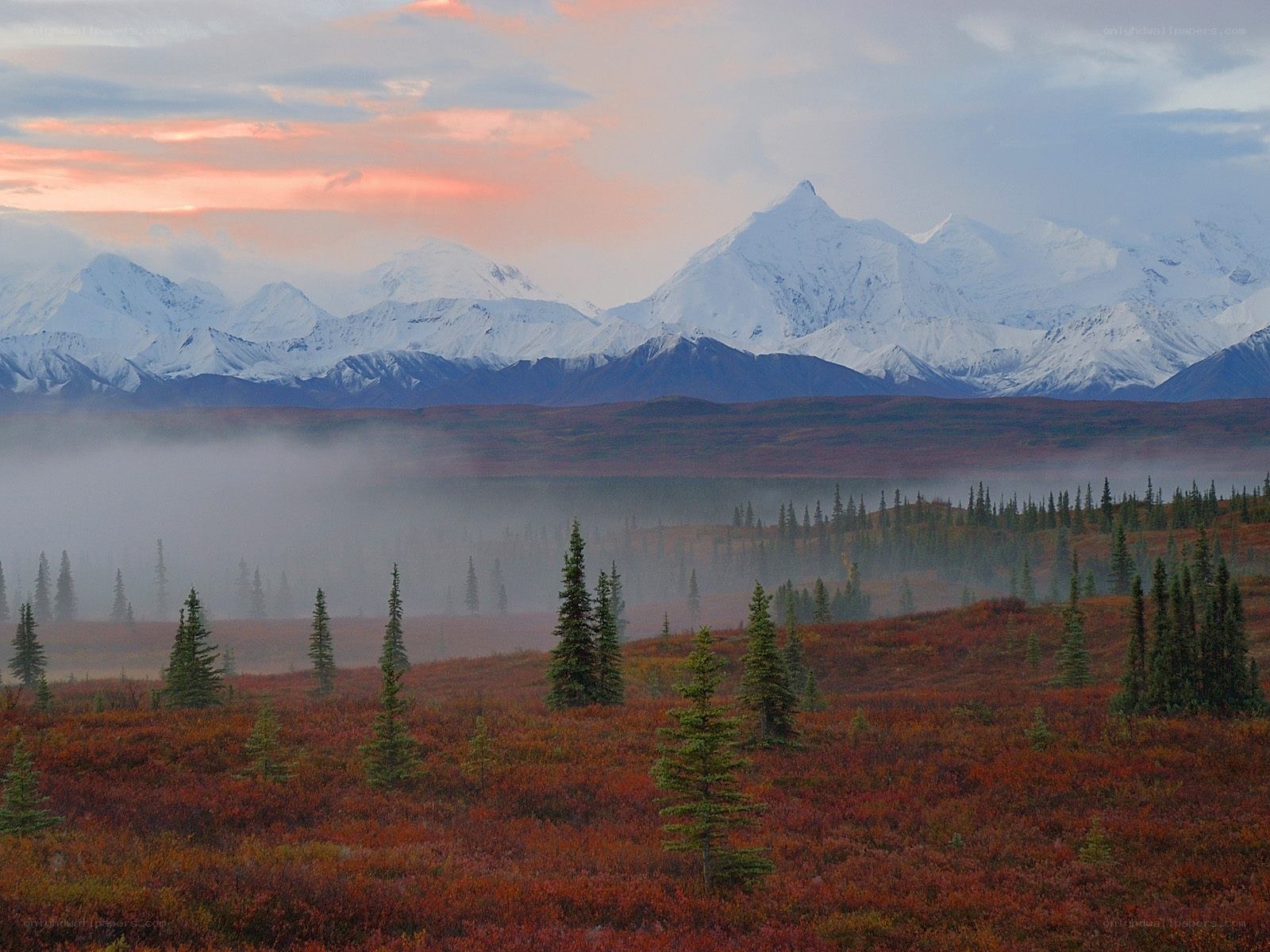 Snow-capped mountains at dawn