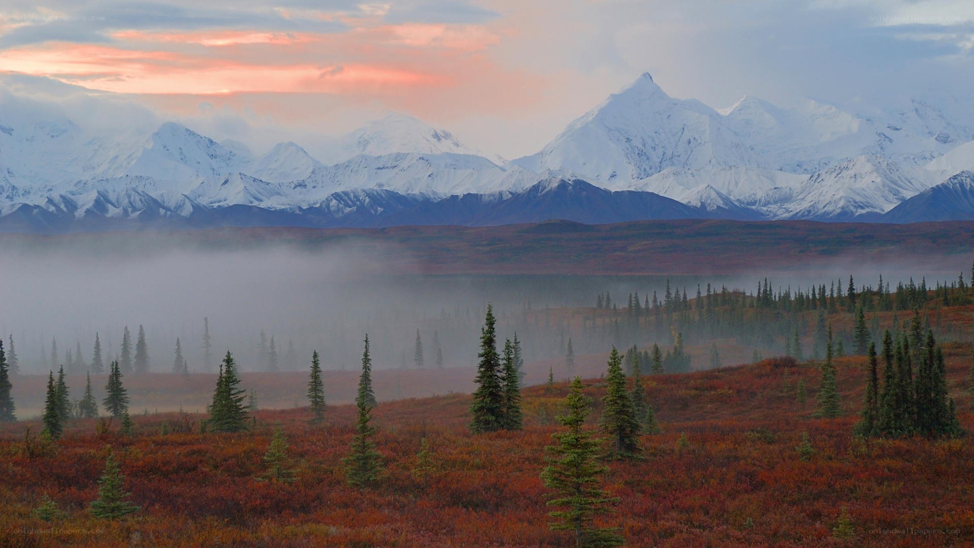 Snow-capped mountains at dawn