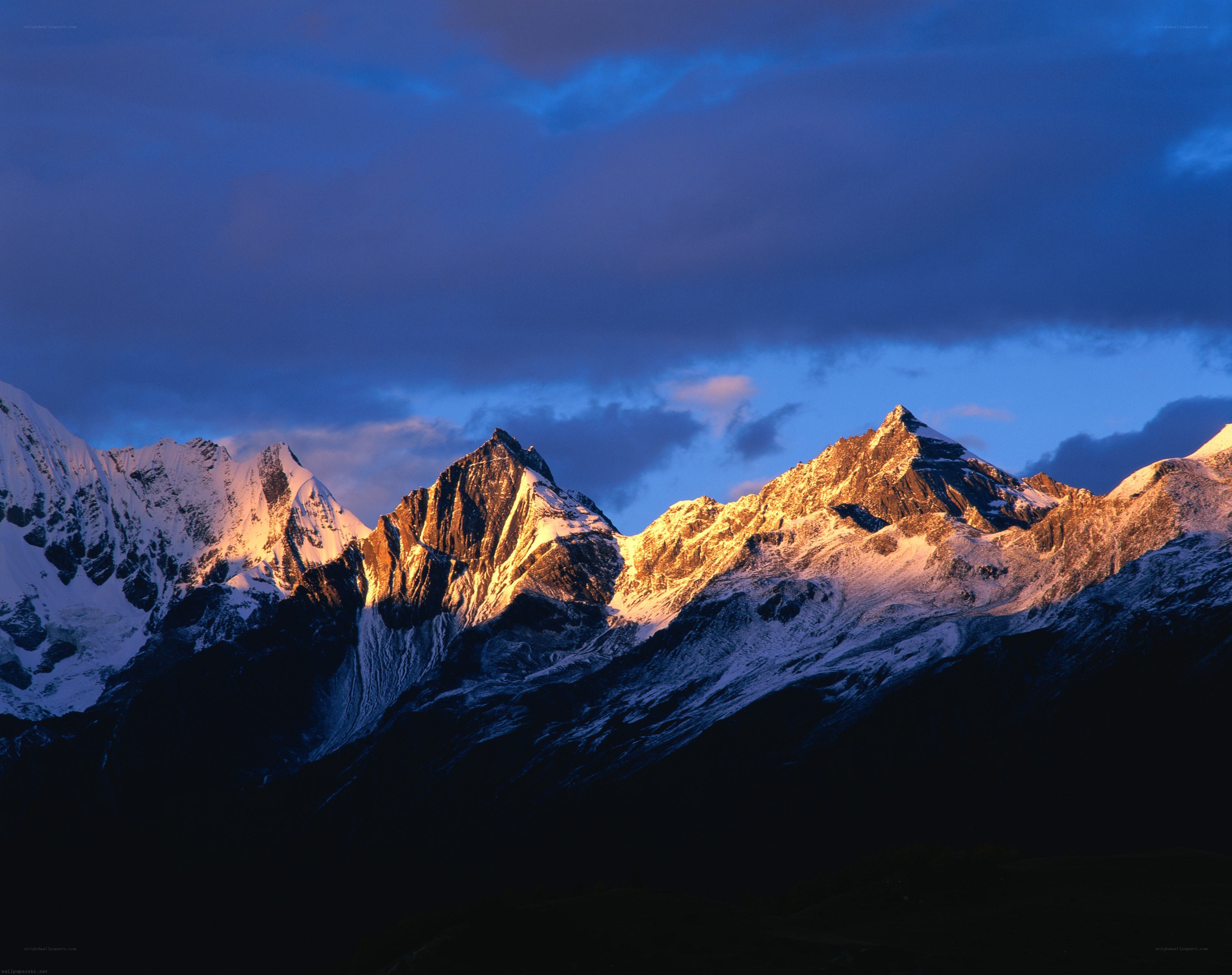 Snow-capped mountains at dawn