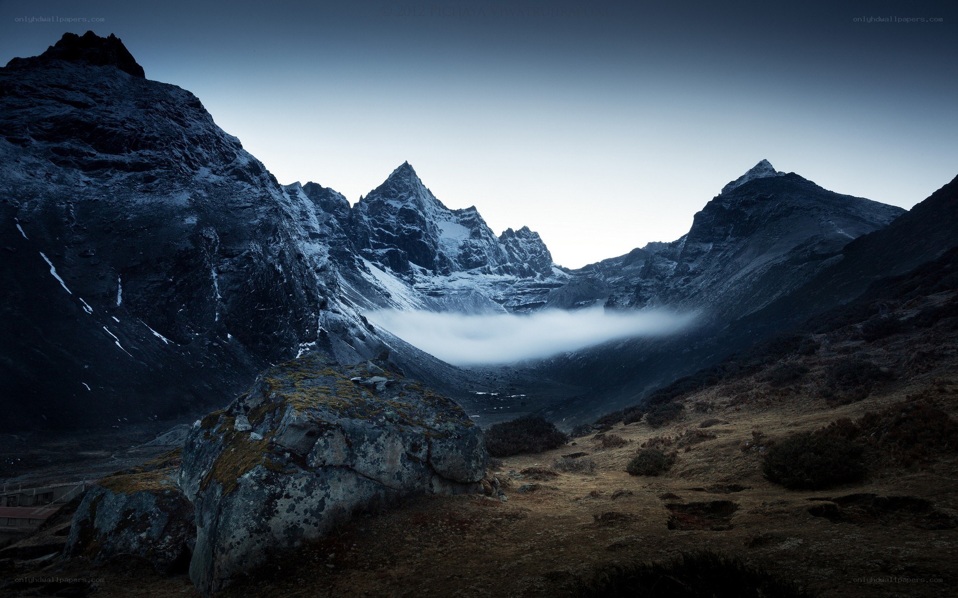 Snow-capped mountains at dawn