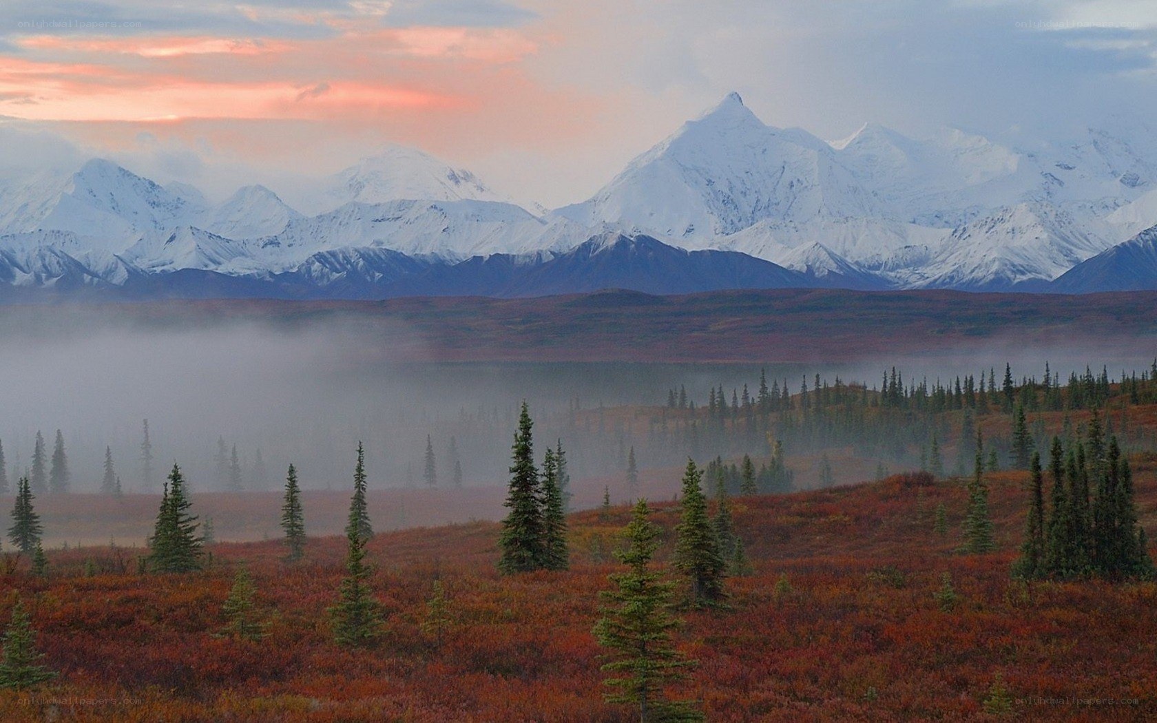 Snow-capped mountains at dawn
