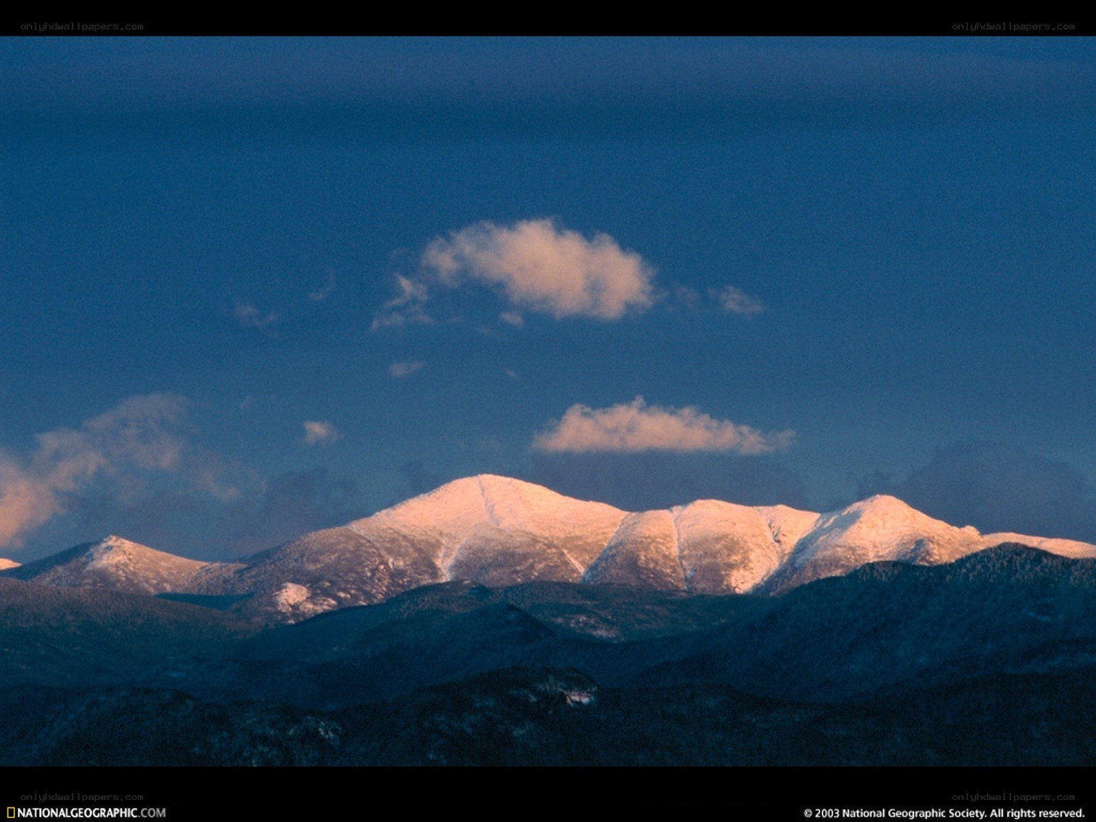 Snow-capped mountains at dawn