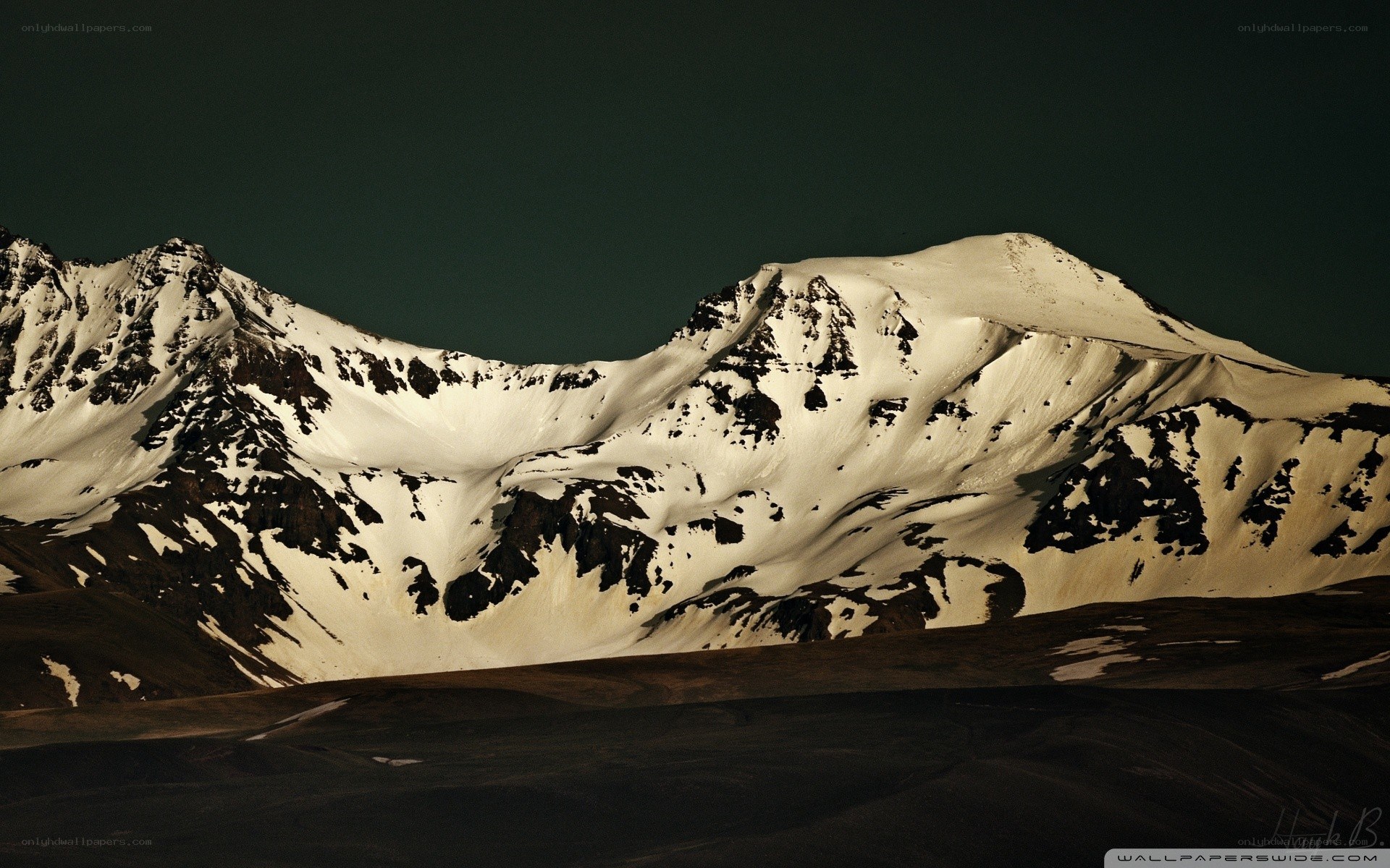 snow-capped mountains at dusk