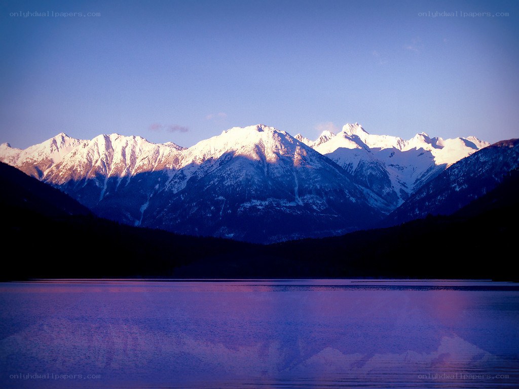 snow-capped mountains at dusk
