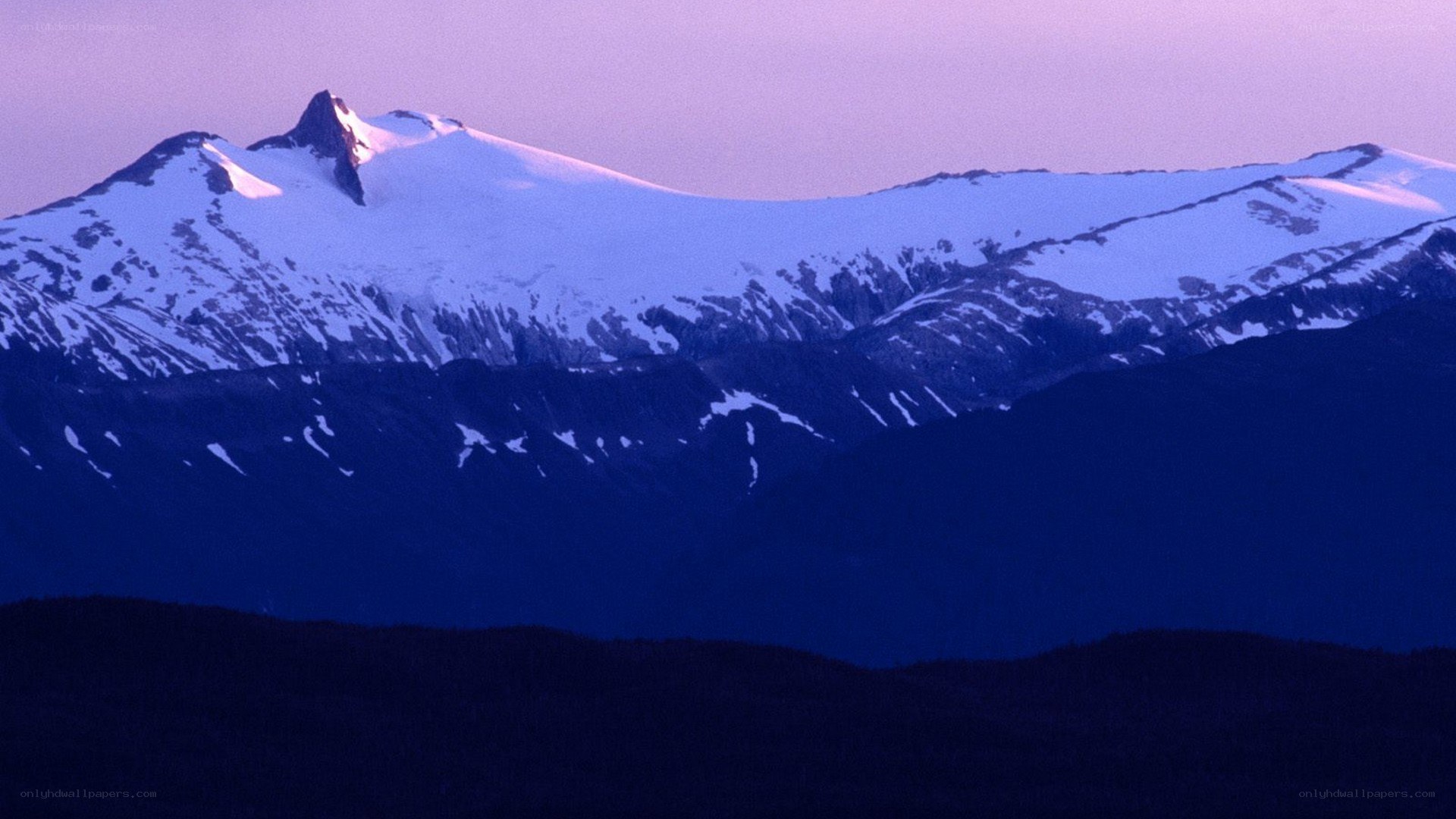 snow-capped mountains at dusk