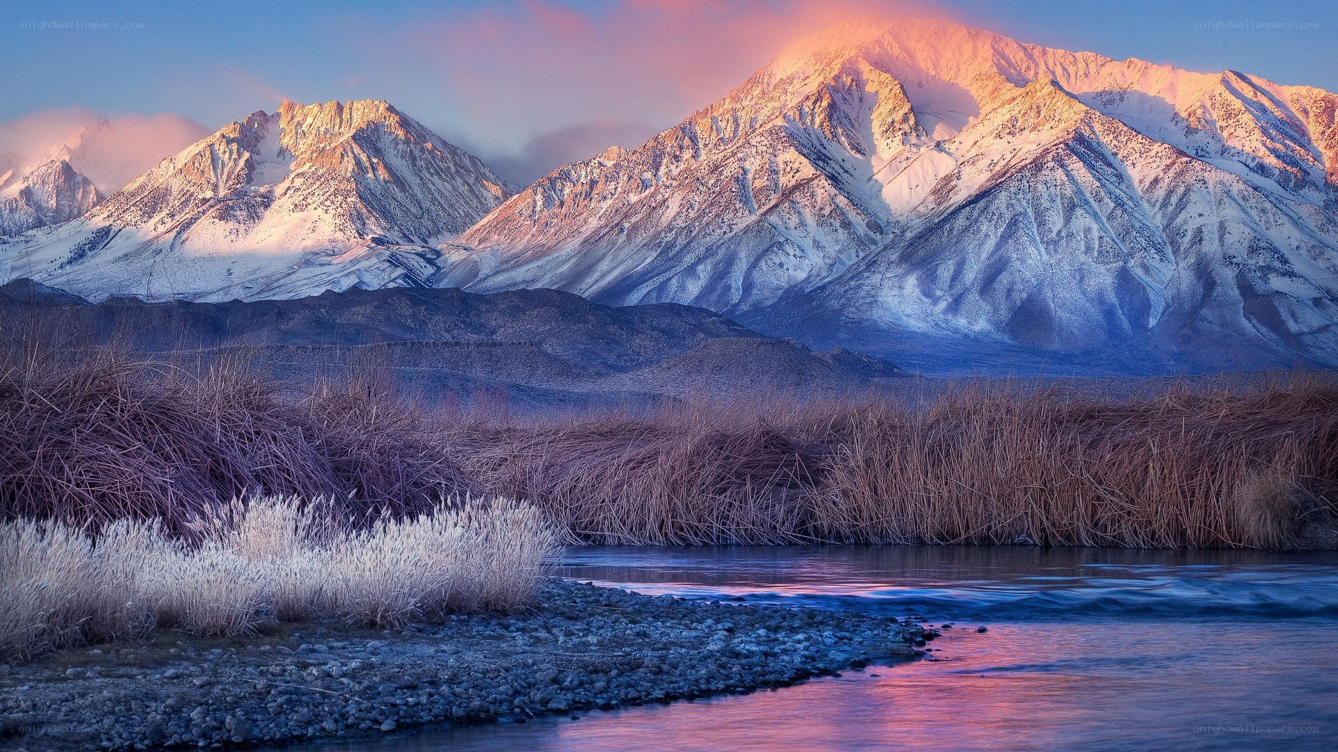 Snow-capped mountains at sunrise