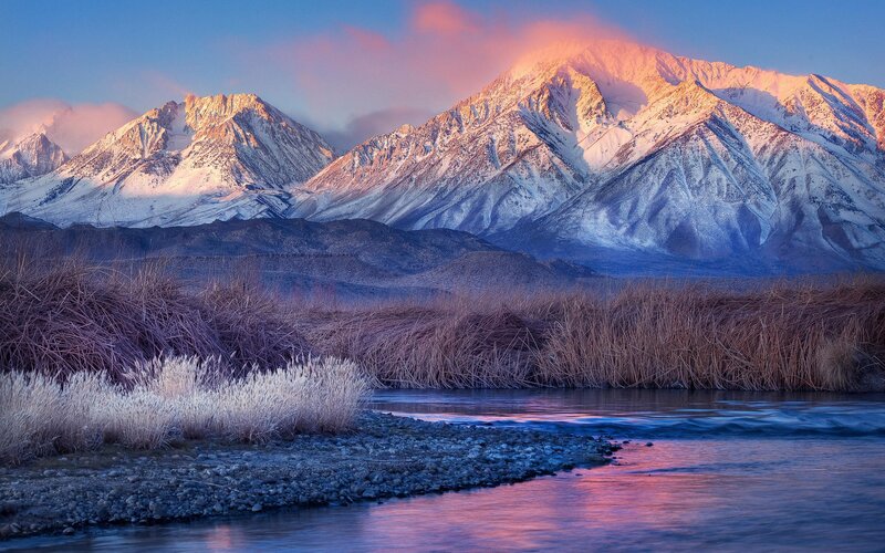 Snow-capped mountains at sunrise