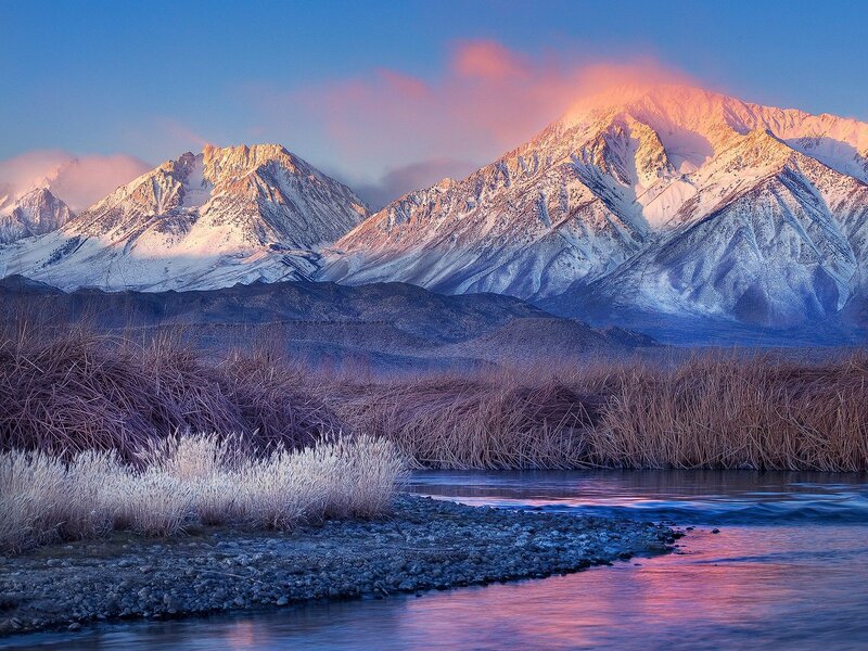 Snow-capped mountains at sunrise