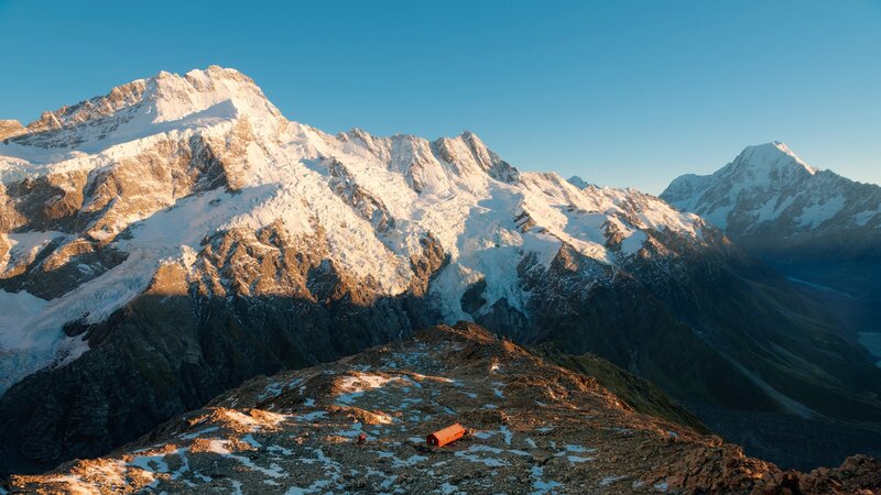 Snow-capped mountains at sunrise