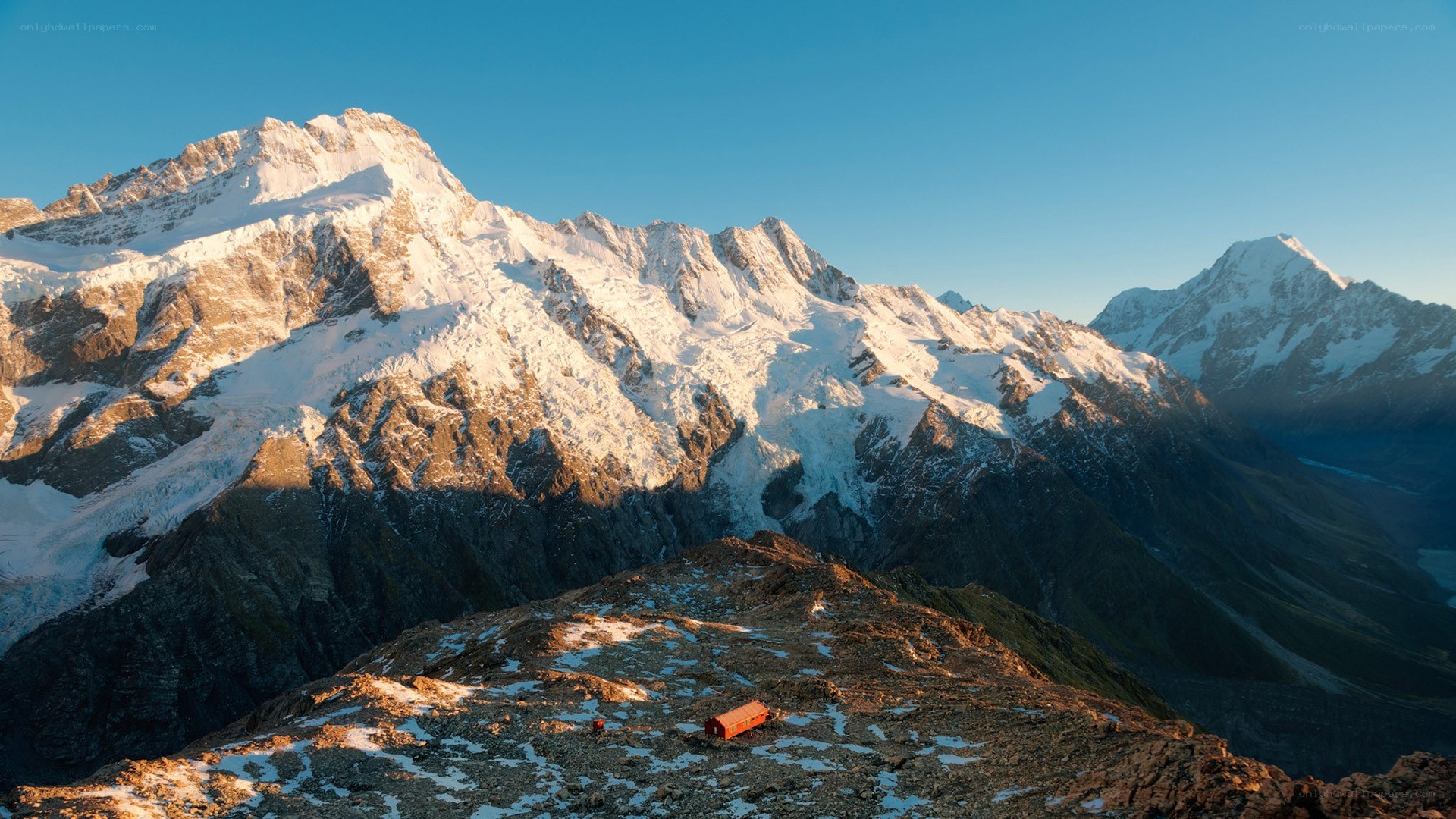 Snow-capped mountains at sunrise