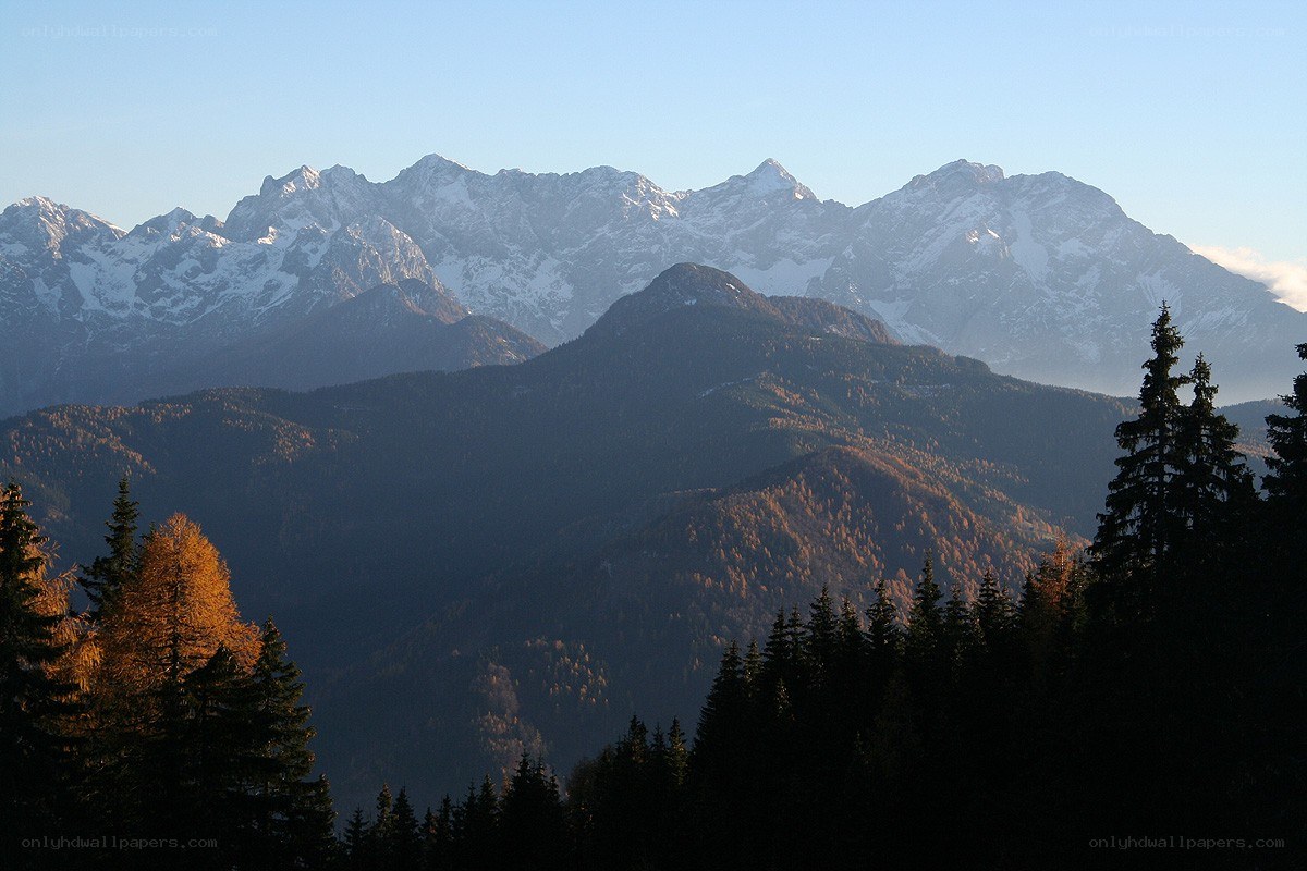 Snow-capped mountains at sunrise