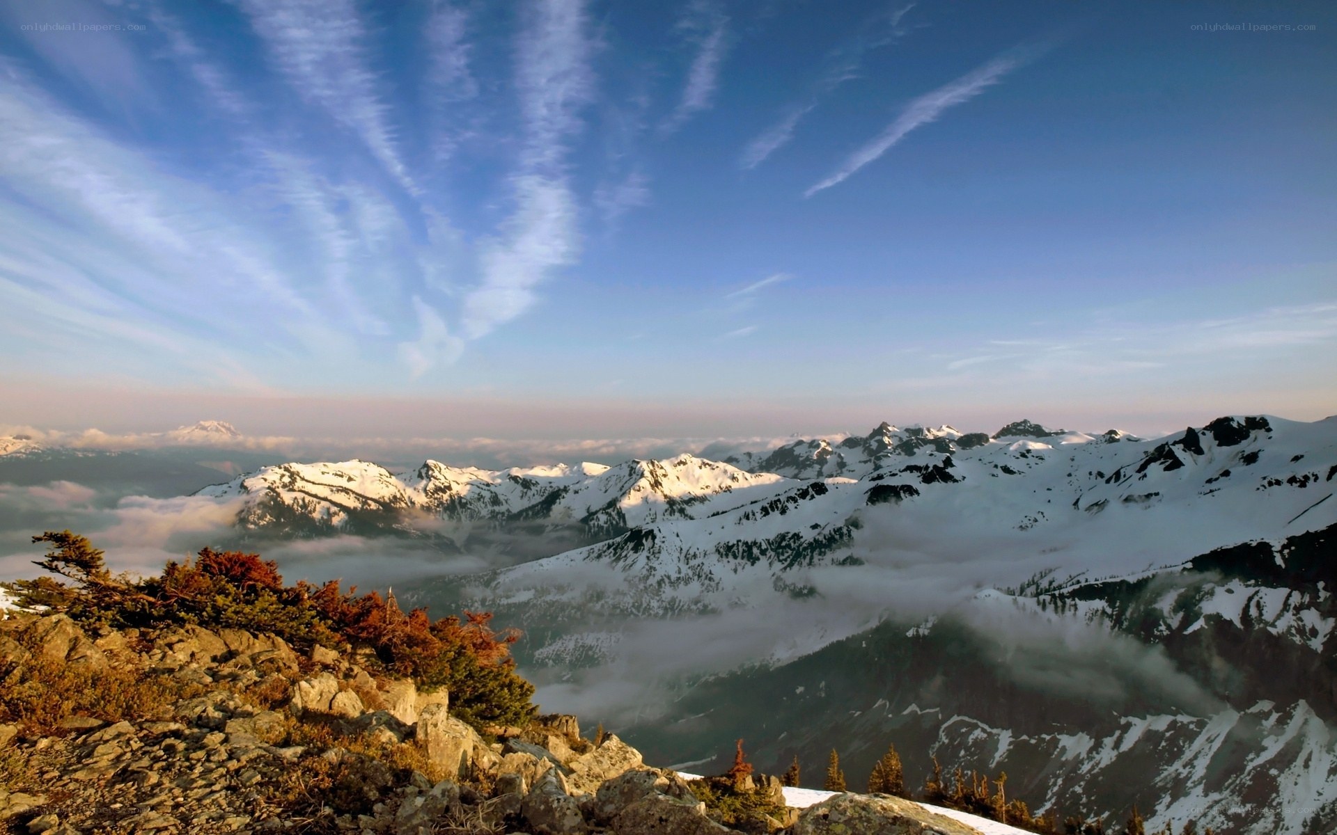 Snow-capped mountains at sunrise
