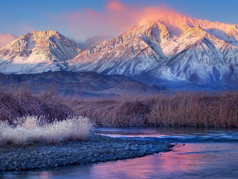 Snow-capped mountains at sunrise