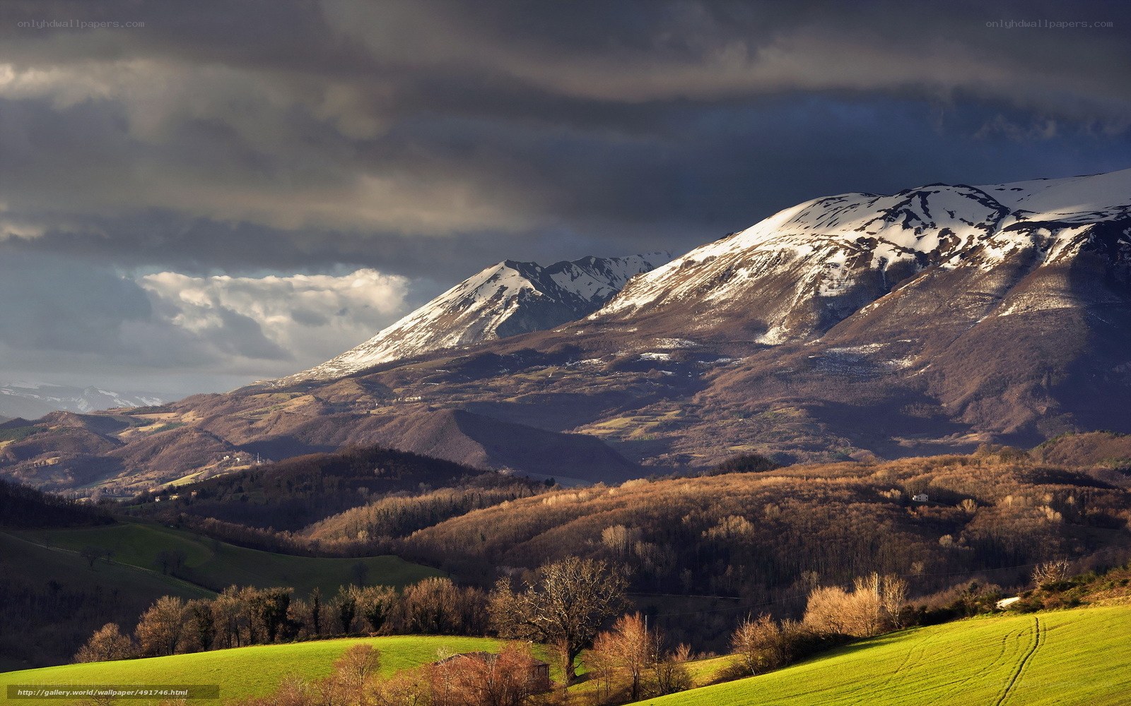 Snow-capped mountains at sunset
