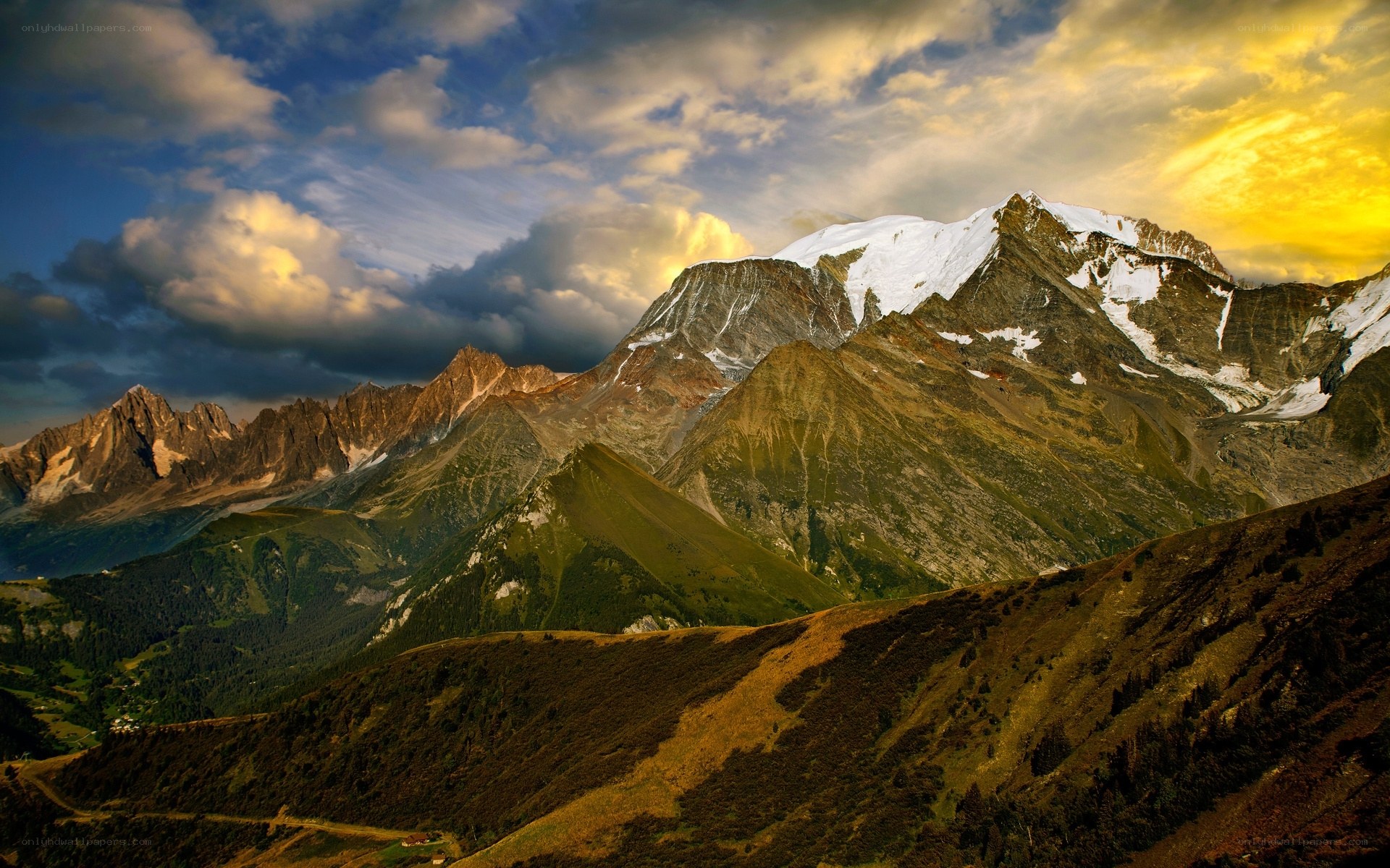 Snow-capped mountains at sunset