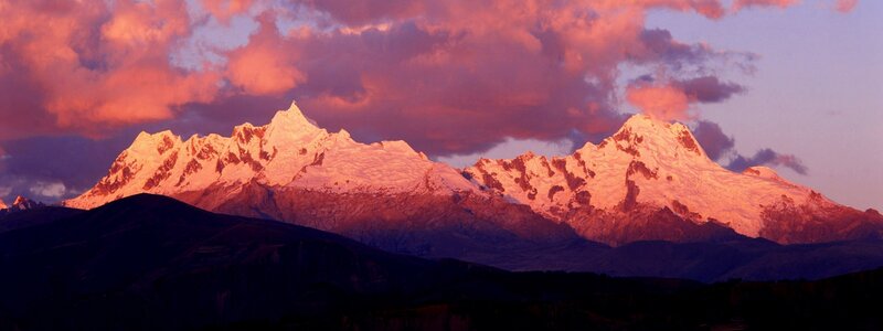 Snow-capped mountains at sunset