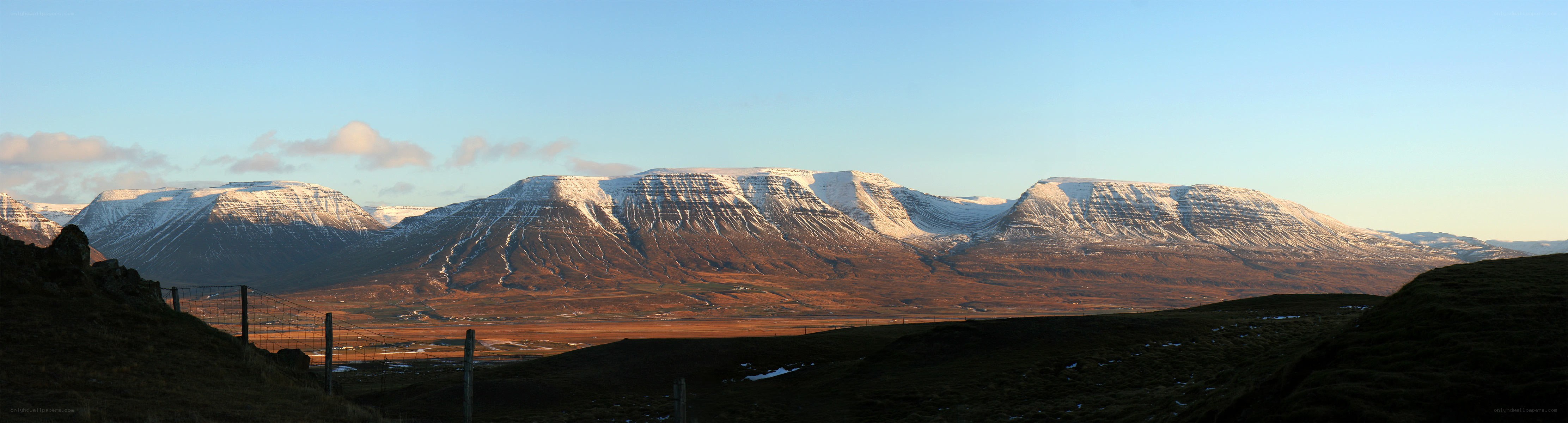 Snow-capped mountains at sunset
