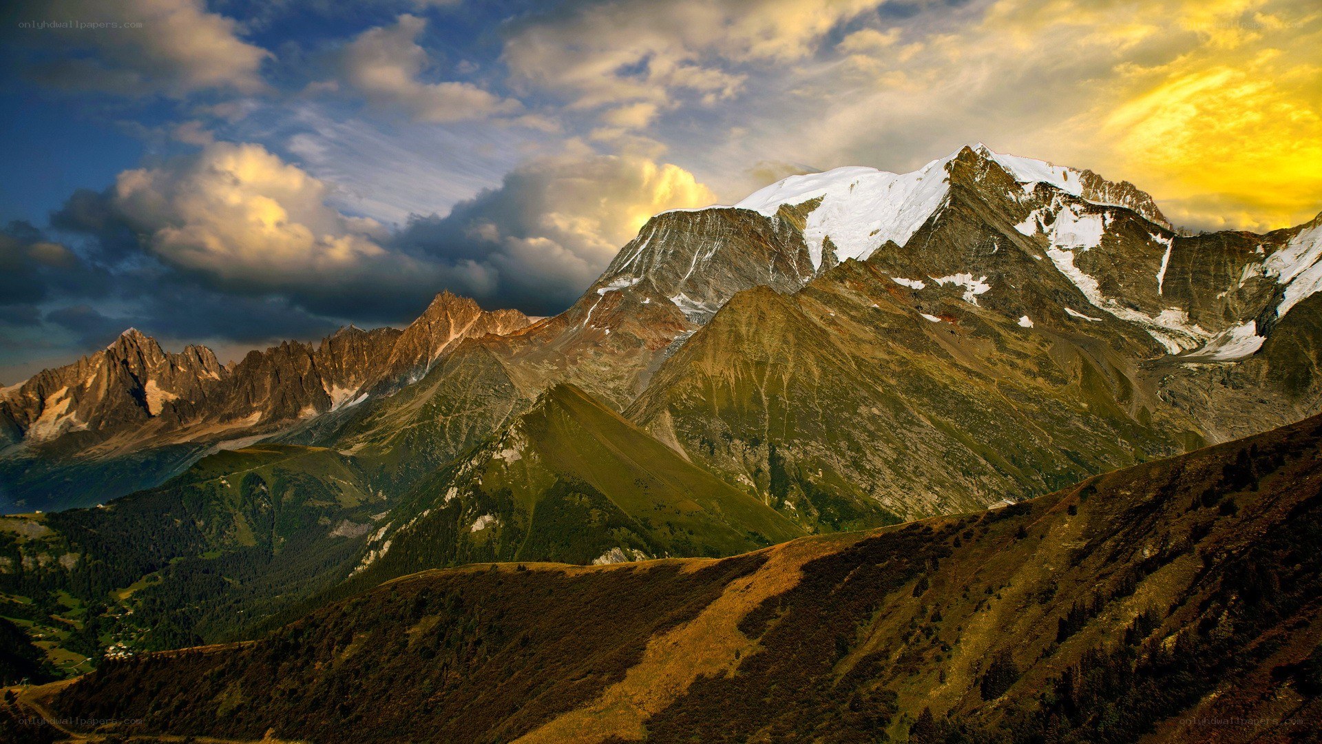 Snow-capped mountains at sunset