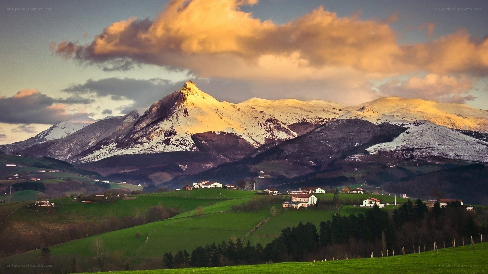 Snow-capped mountains at sunset