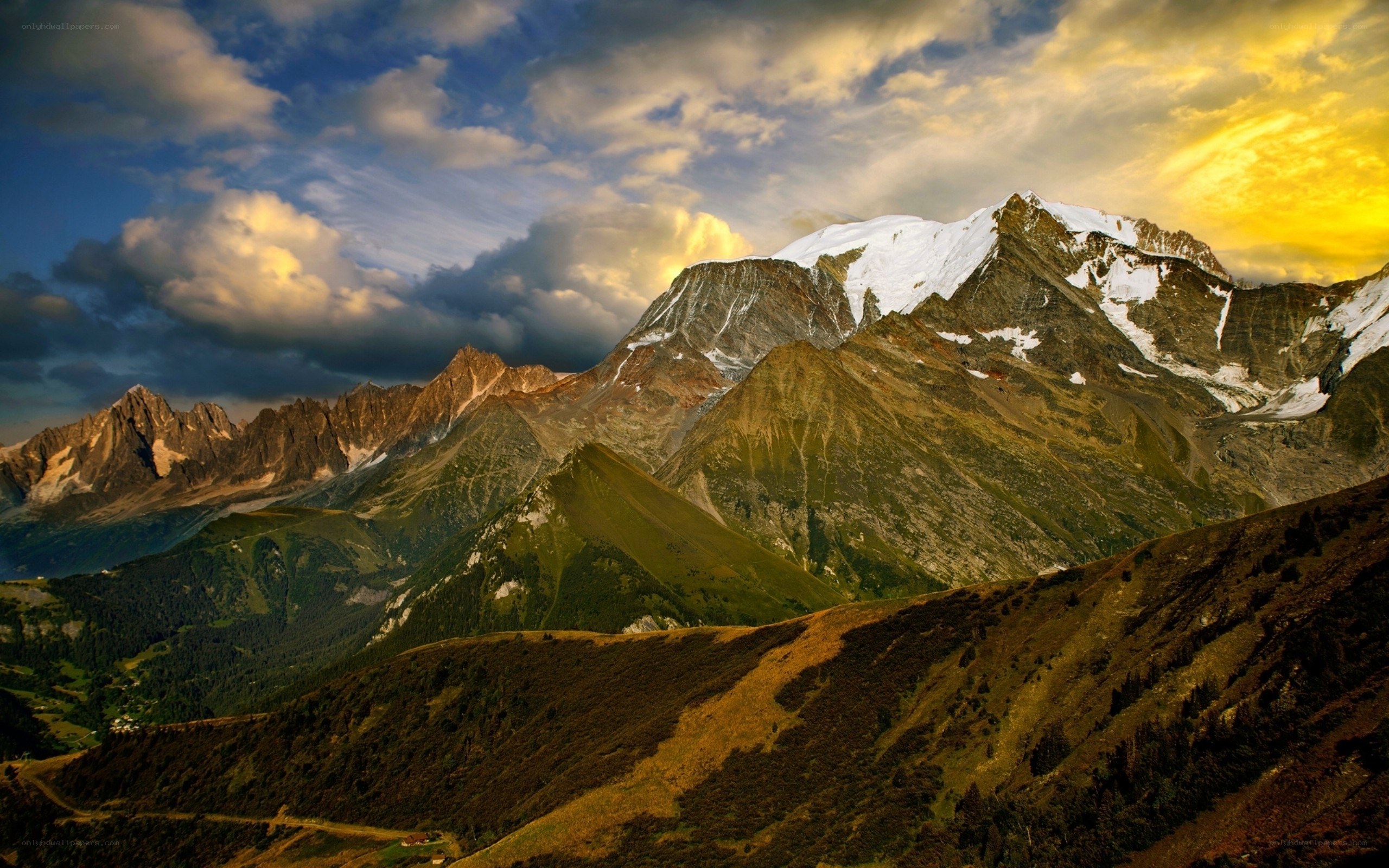 Snow-capped mountains at sunset