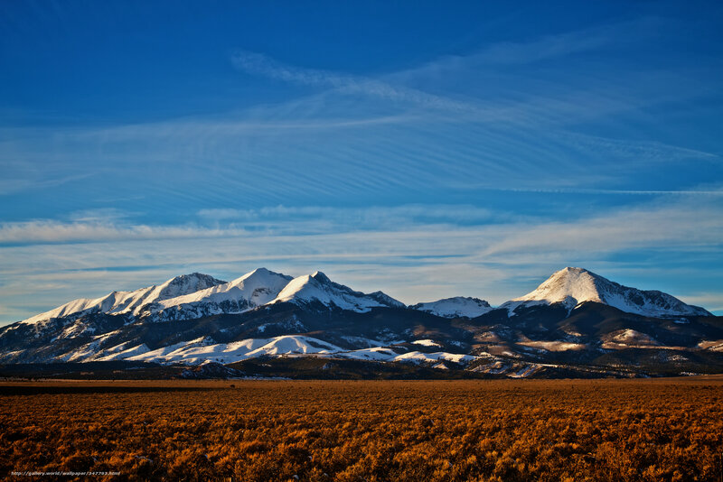 Snow-capped mountains at sunset
