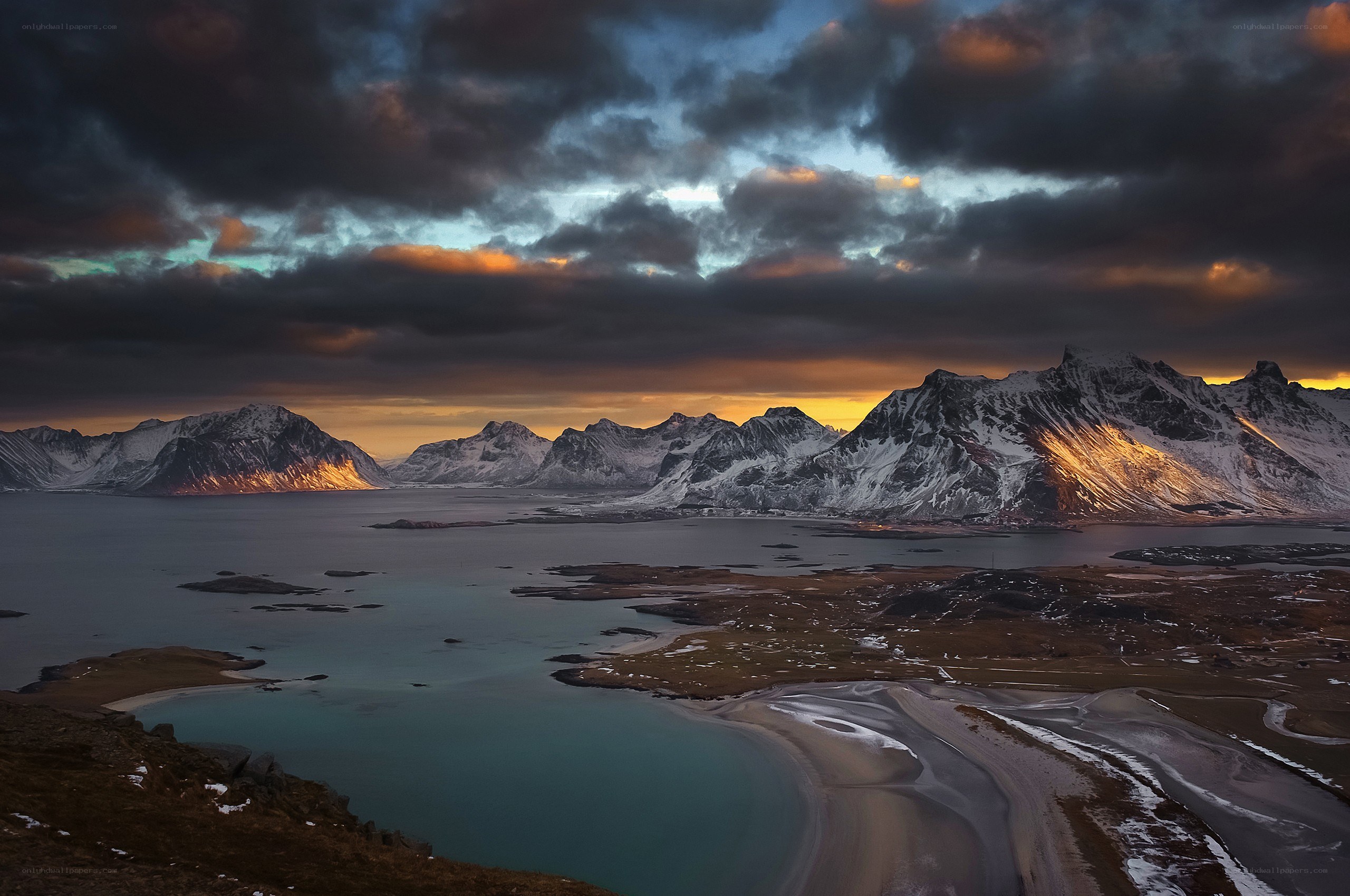 Snow-capped mountains at sunset