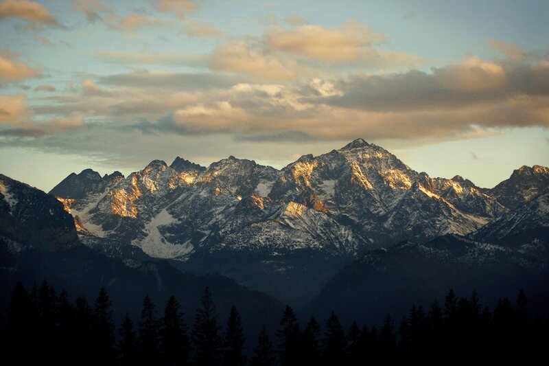 Snow-capped mountains at sunset