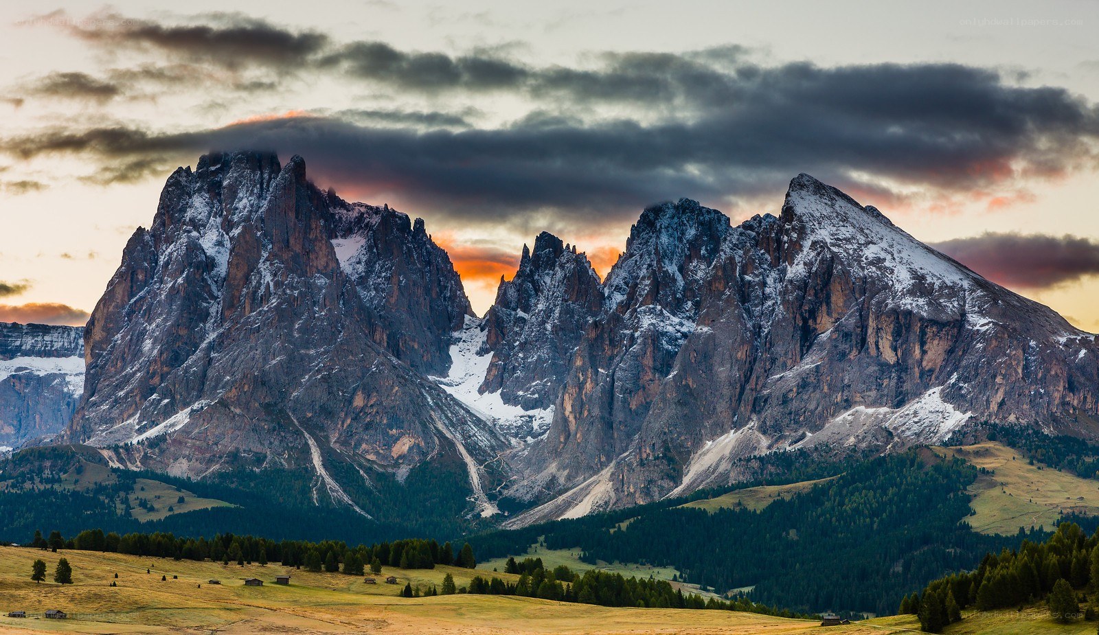 Snow-capped mountains at sunset