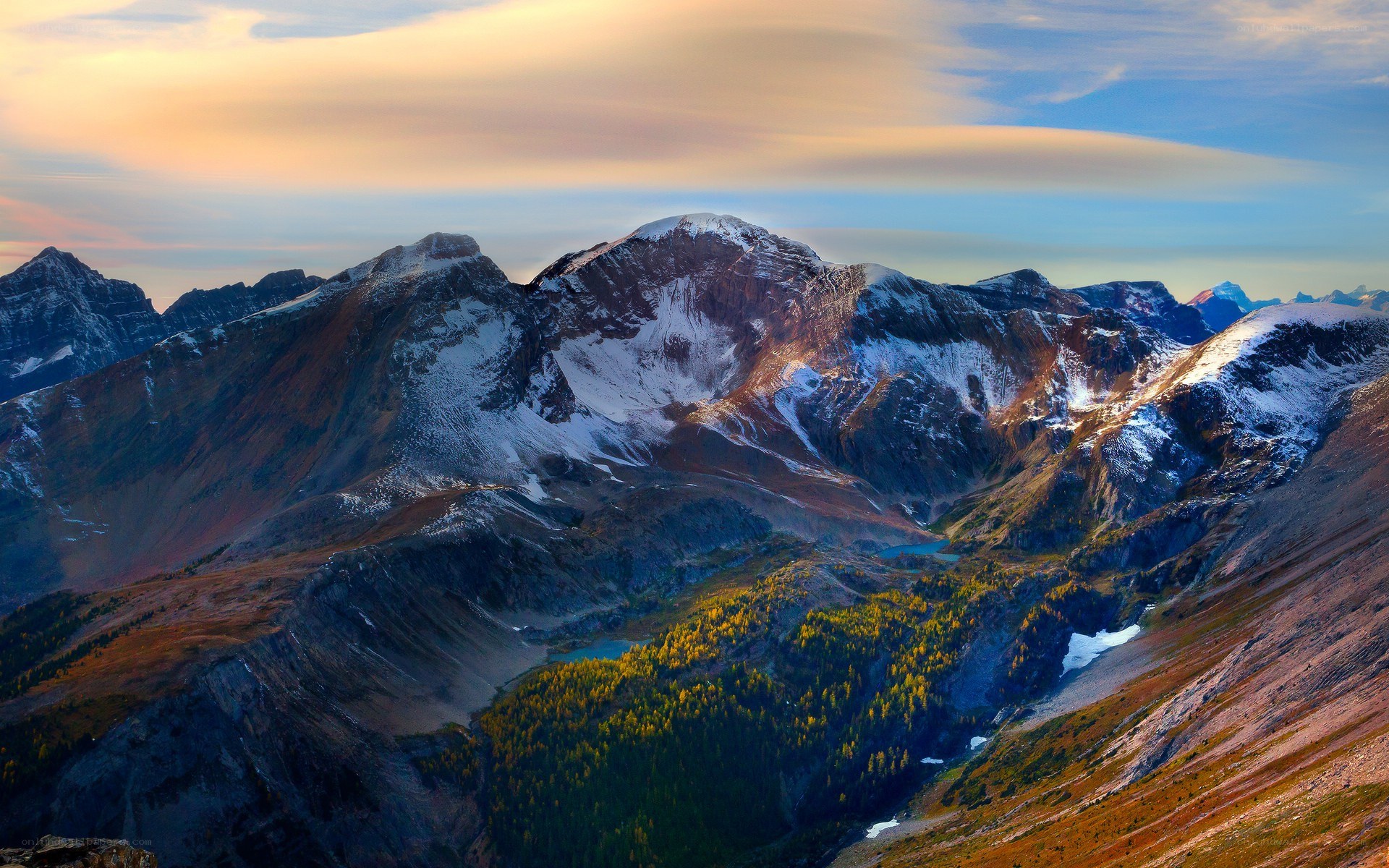 Snow-capped mountains at sunset