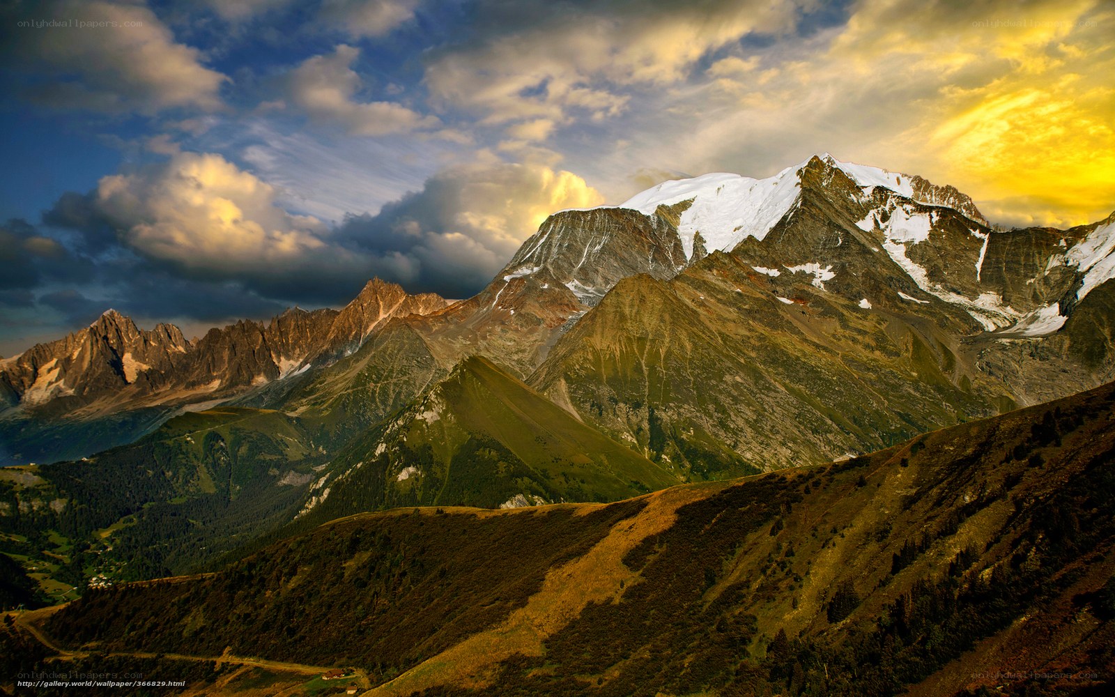 Snow-capped mountains at sunset