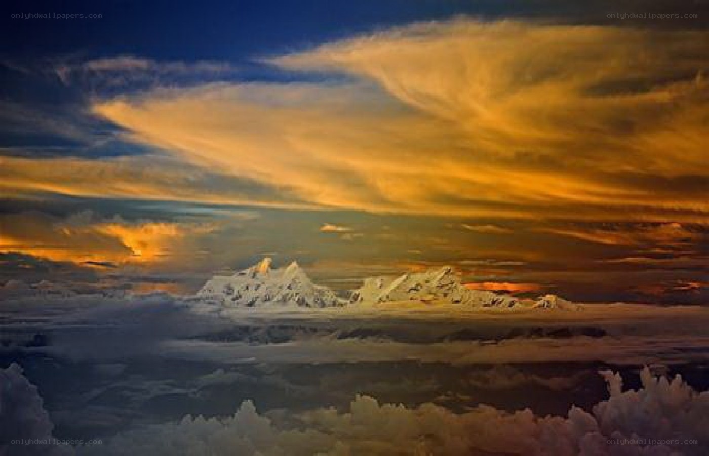 Snow-capped mountains at sunset