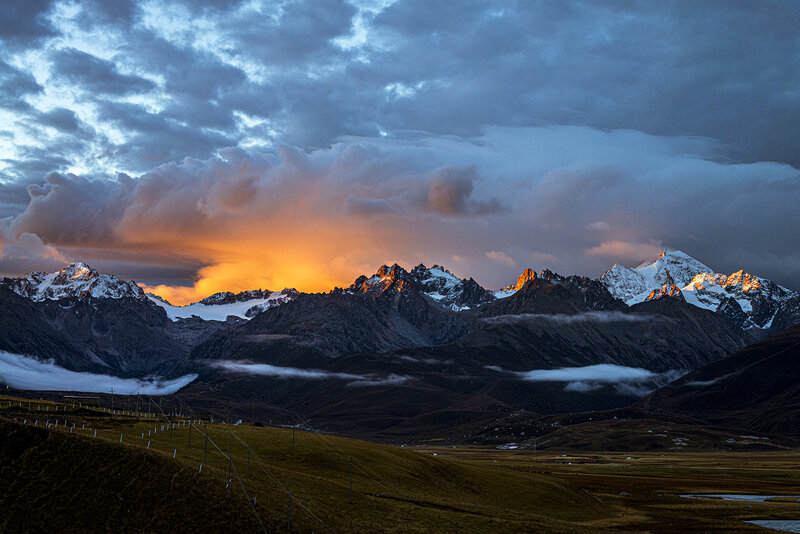 Snow-capped Mountains at Sunset — Orange, Dramatic, Photograph, Clouds, Valley