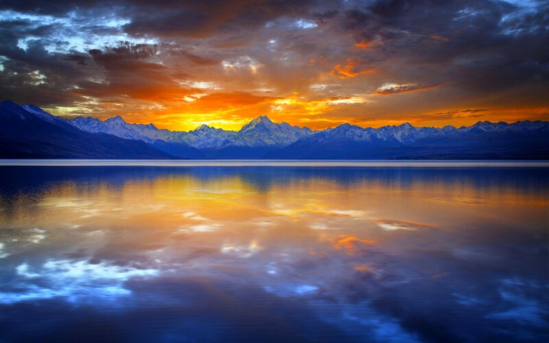 Snow-capped Mountains at Sunset — Orange, Dramatic, Photograph