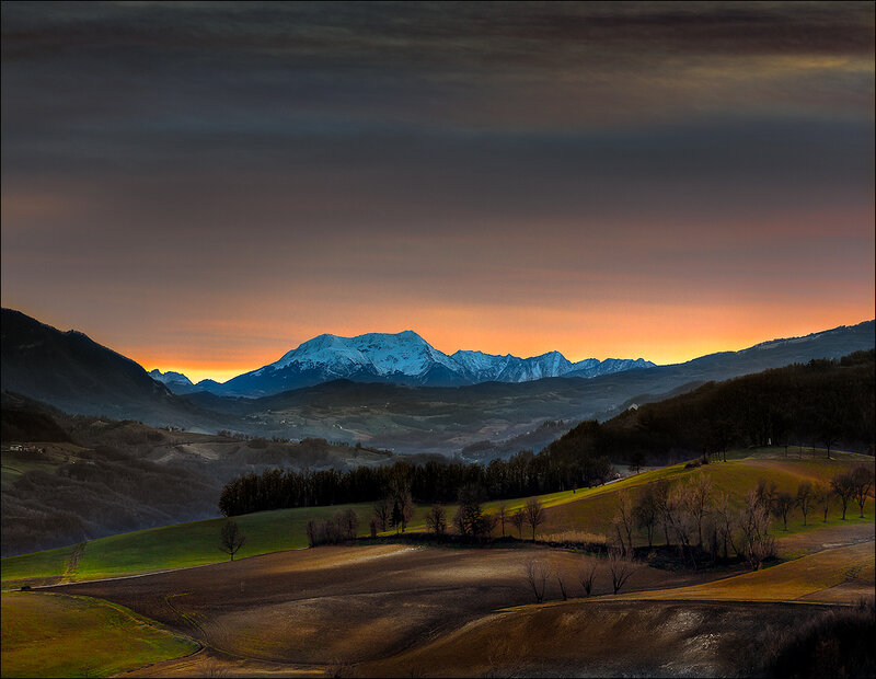 Snow-capped Mountains at Sunset — Orange, Dramatic
