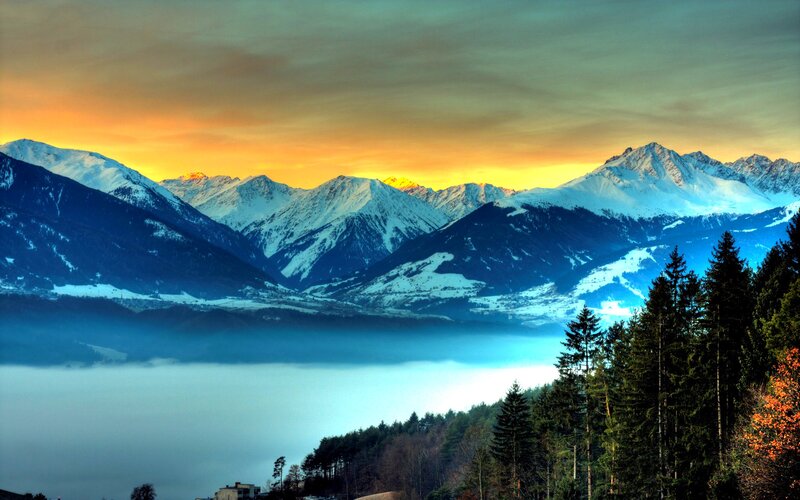 Snow-capped Mountains at Sunset — Orange, Serene, Photograph, Fog